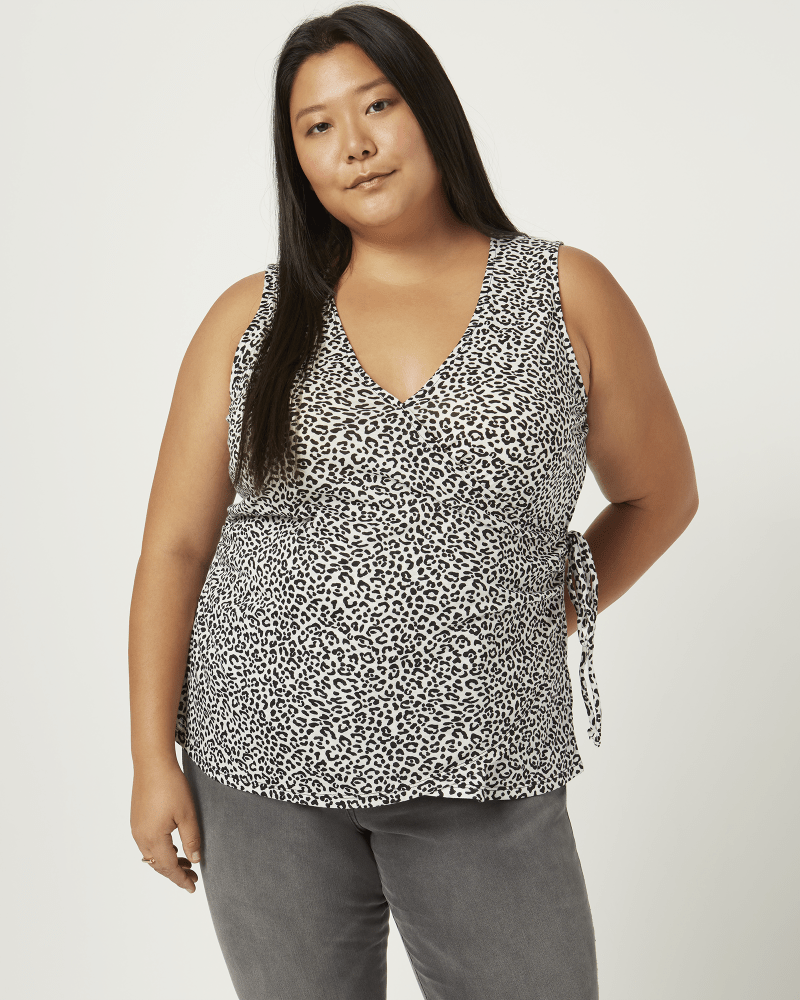 Front of a model wearing a size 1X Liberty Faux Wrap Tank Top in Ivory / Black by East Adeline. | dia_product_style_image_id:210607